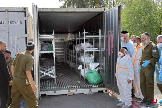 以法医检验千具遗体 称哈马斯施以酷刑折磨