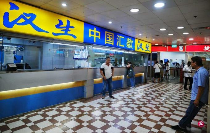 社论:新中加强合作 完善汇款监管