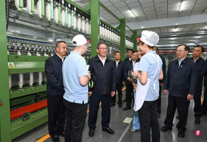 李强调研新疆考察被美国制裁纺企