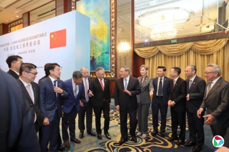 颜金勇:新中致力营造稳定营商环境  李强:新中合作可从三方面提质升级